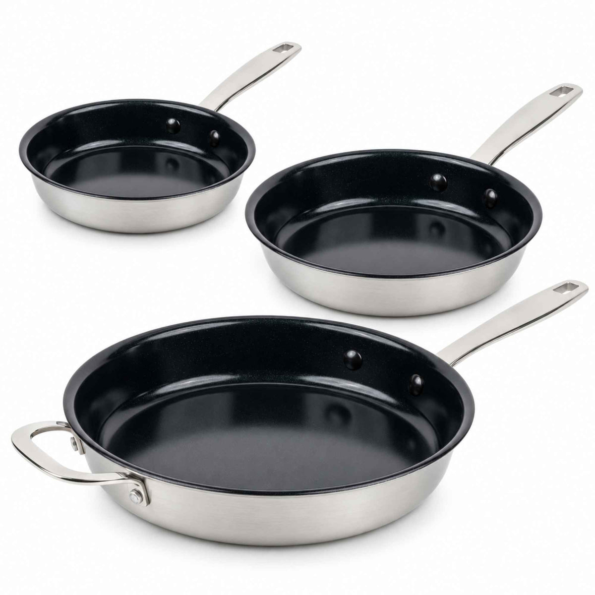 Three Alva Maestro 5-ply nonstick frying pans in graduated sizes with stainless steel exteriors on white