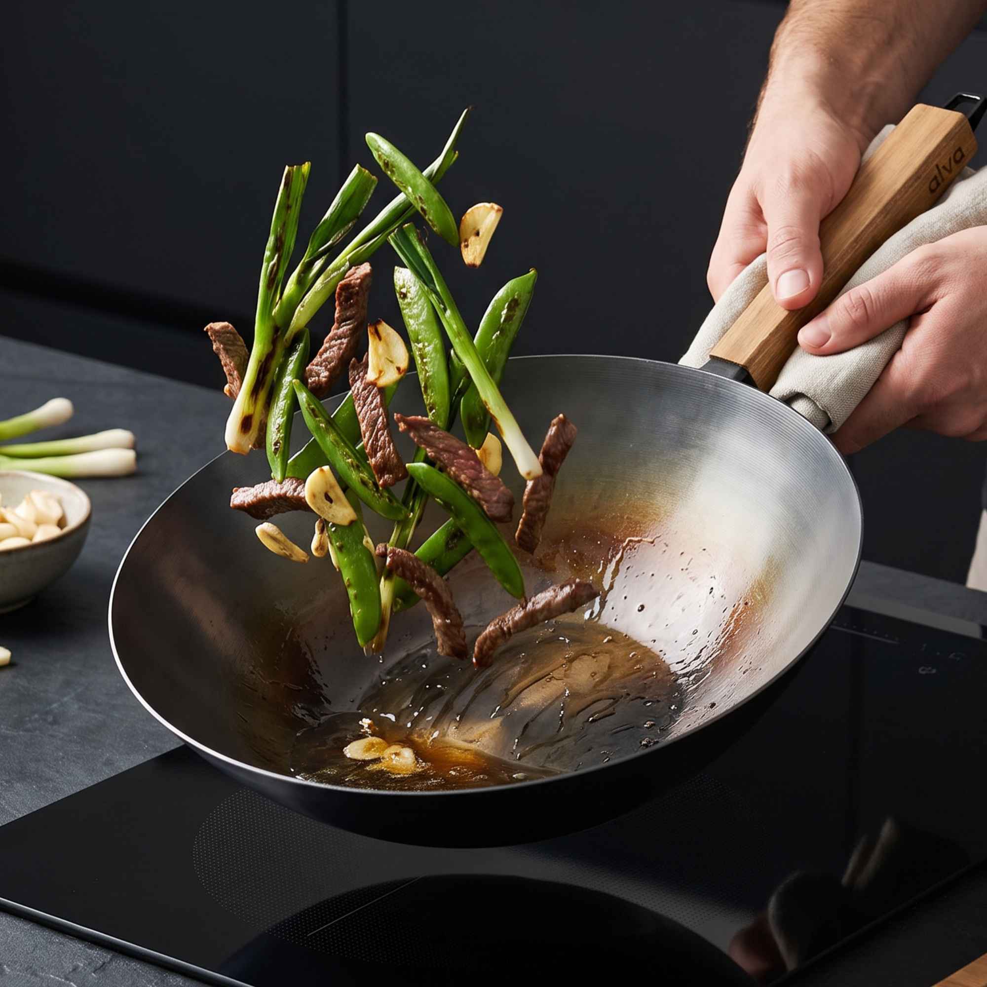 Alva Forest carbon steel wok tossing stir-fry vegetables
