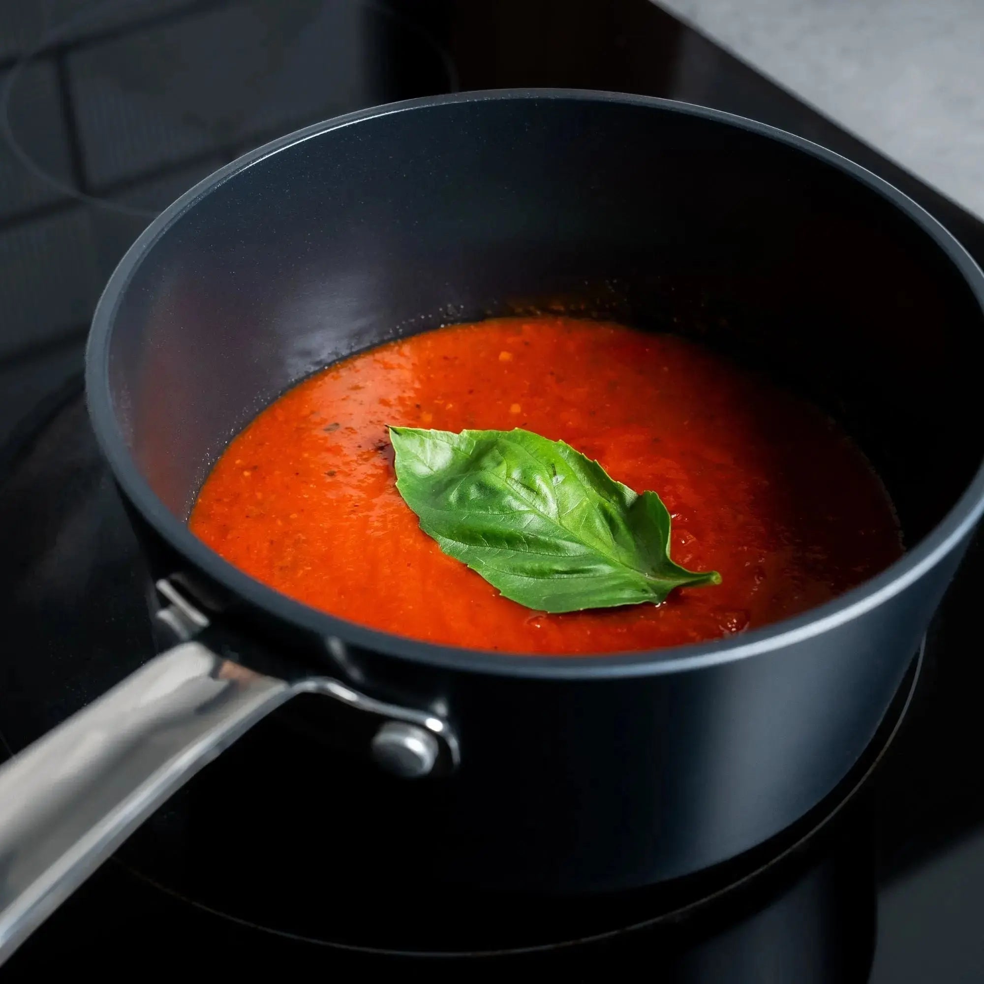 Alva Maestro ceramic nonstick saucepan simmering tomato sauce