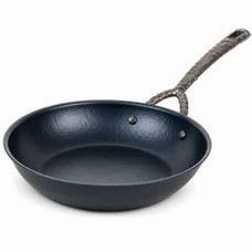 Alva Artist hammered carbon steel frying pan with forged twisted handle on a white background