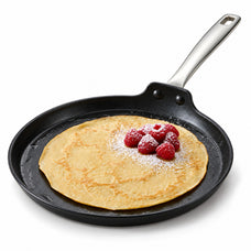 Alva Maestro 10-inch ceramic nonstick crepe pan with a raspberry-topped crepe on a white background