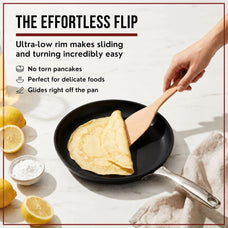 Folding a crepe with a wooden spatula in the low-rim Alva Maestro ceramic nonstick crepe pan