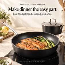 Salmon and asparagus in an Alva Maestro ceramic nonstick frying pan on induction, matching saucepan behind