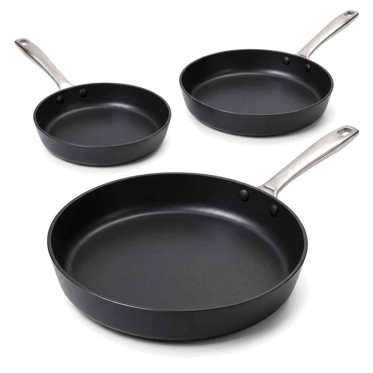 Three Alva Maestro black ceramic nonstick frying pans in graduated sizes on a white background