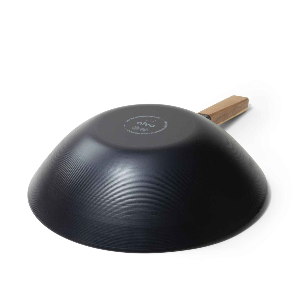 Underside of the Alva Forest 12-inch carbon steel wok with a wooden handle on a white background