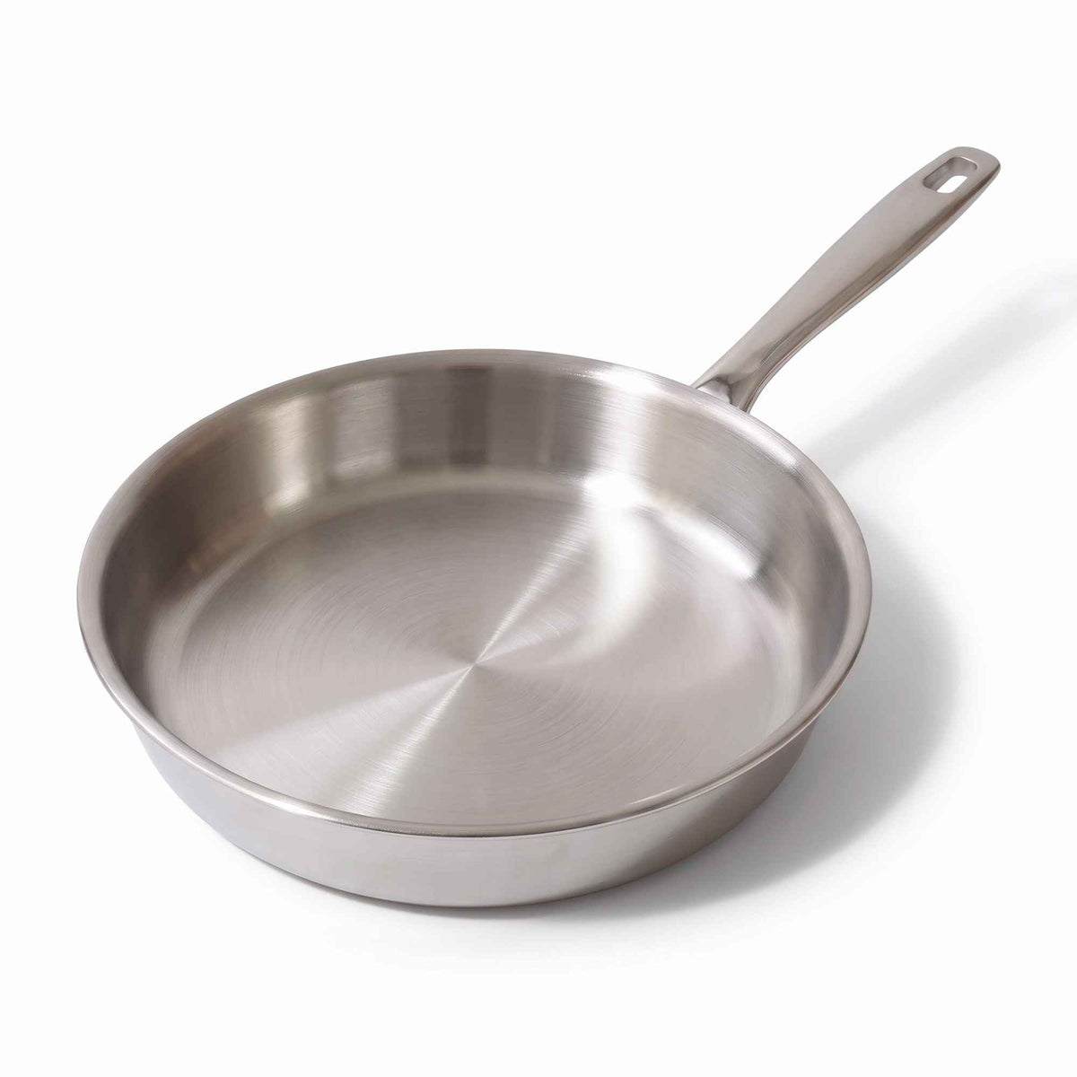 Stainless steel frying pan with a long handle on a white background