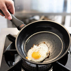 Alva Energy ceramic nonstick frying pan cooking an egg