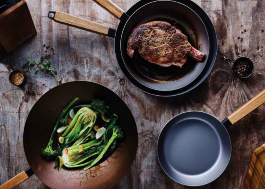 Alva Forest carbon steel cookware serving steak and vegetables