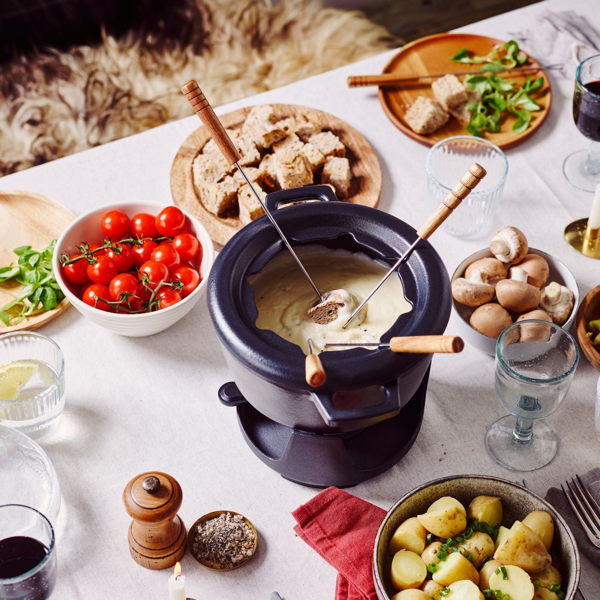 Alva Nori cast iron fondue set serving cheese and bread
