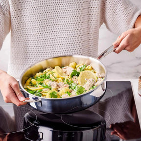 Alva stainless steel sauté pan serving pasta on induction