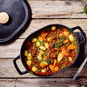 Alva Nori oval Dutch oven filled with vegetable stew